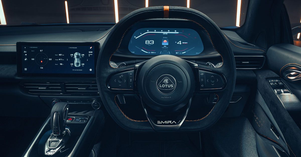 A shot of the interior steering wheel and centre dashboard of the 2022 Lotus Emira