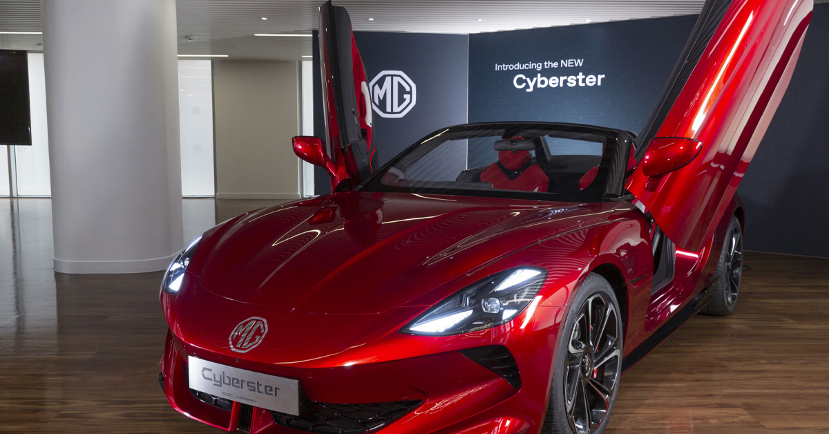 An image of the front of the 2024 MG Cyberster Roadster EV showing the open scissor doors