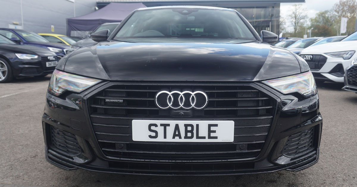 An image of a black Audi A6 from the front