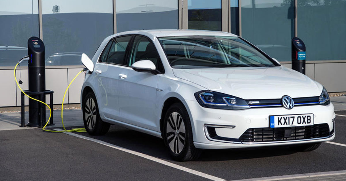 A 2020 Volkswagen e-Golf charging at a public charging station