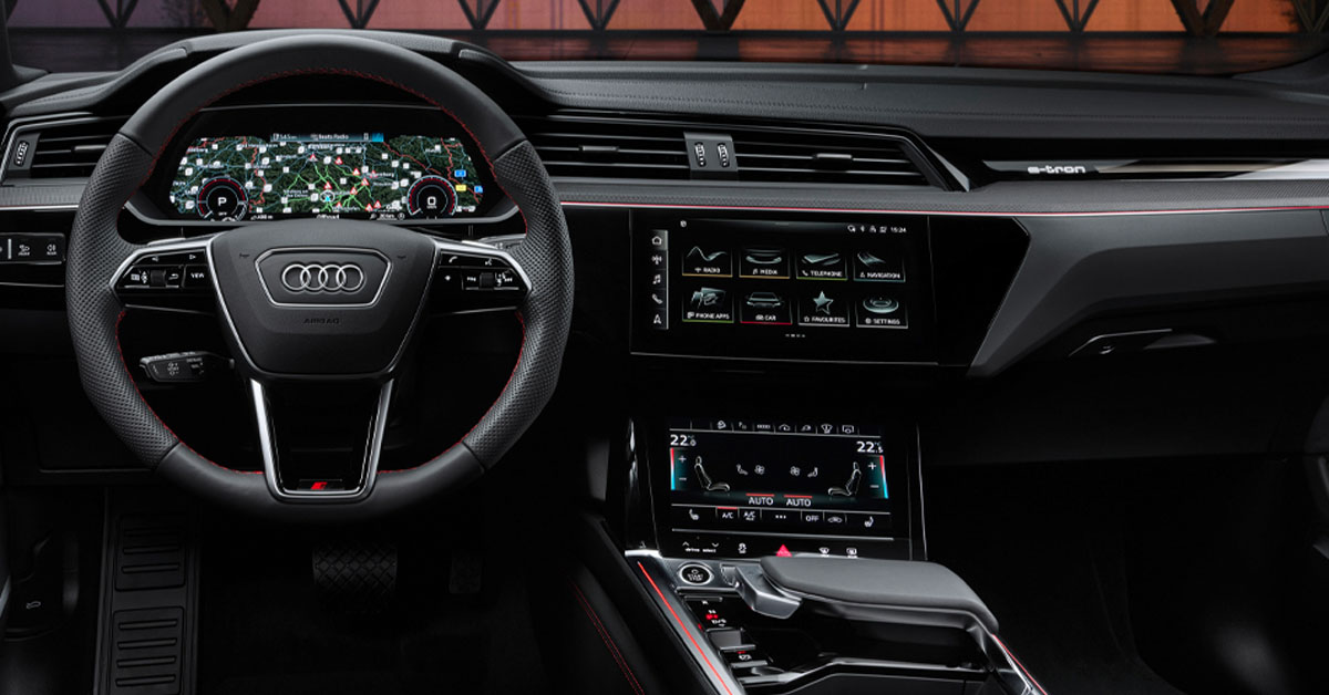 An image of the new 2023 Audi Q8 e-tron SUV showing the interior dashboard and steering wheel