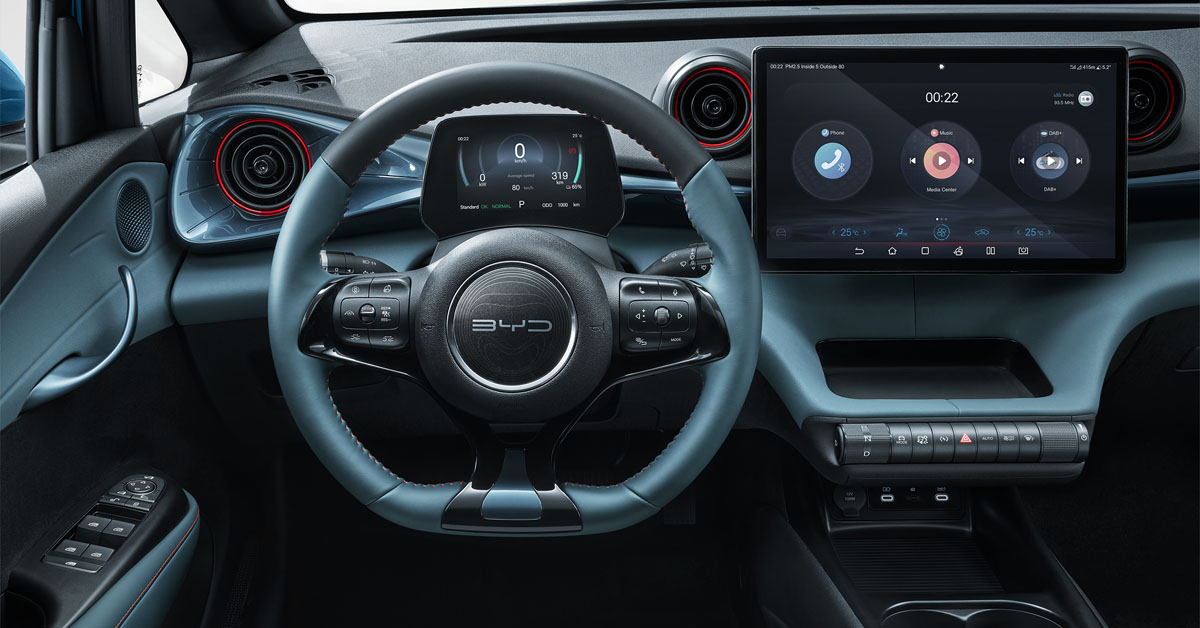 An image showing the interior dashboard and steering wheel area of the 2023 BYD Dolphin electric car