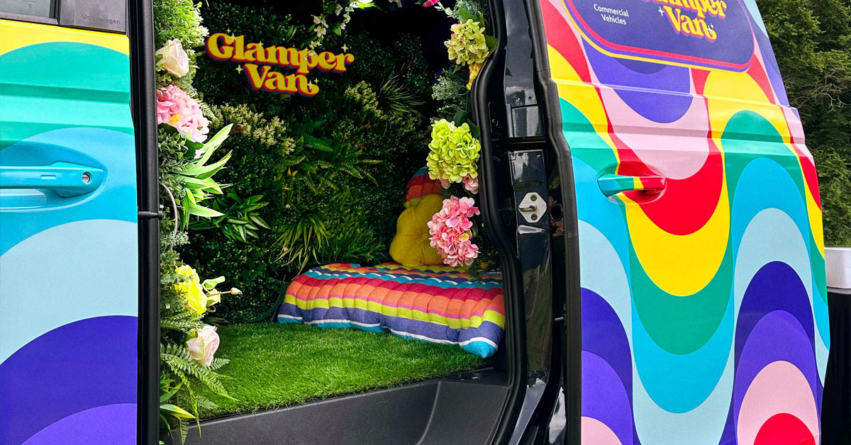 An image of the Volkswagen ID.Buzz 'Glamper Van' showing the interior photo booth and seating section